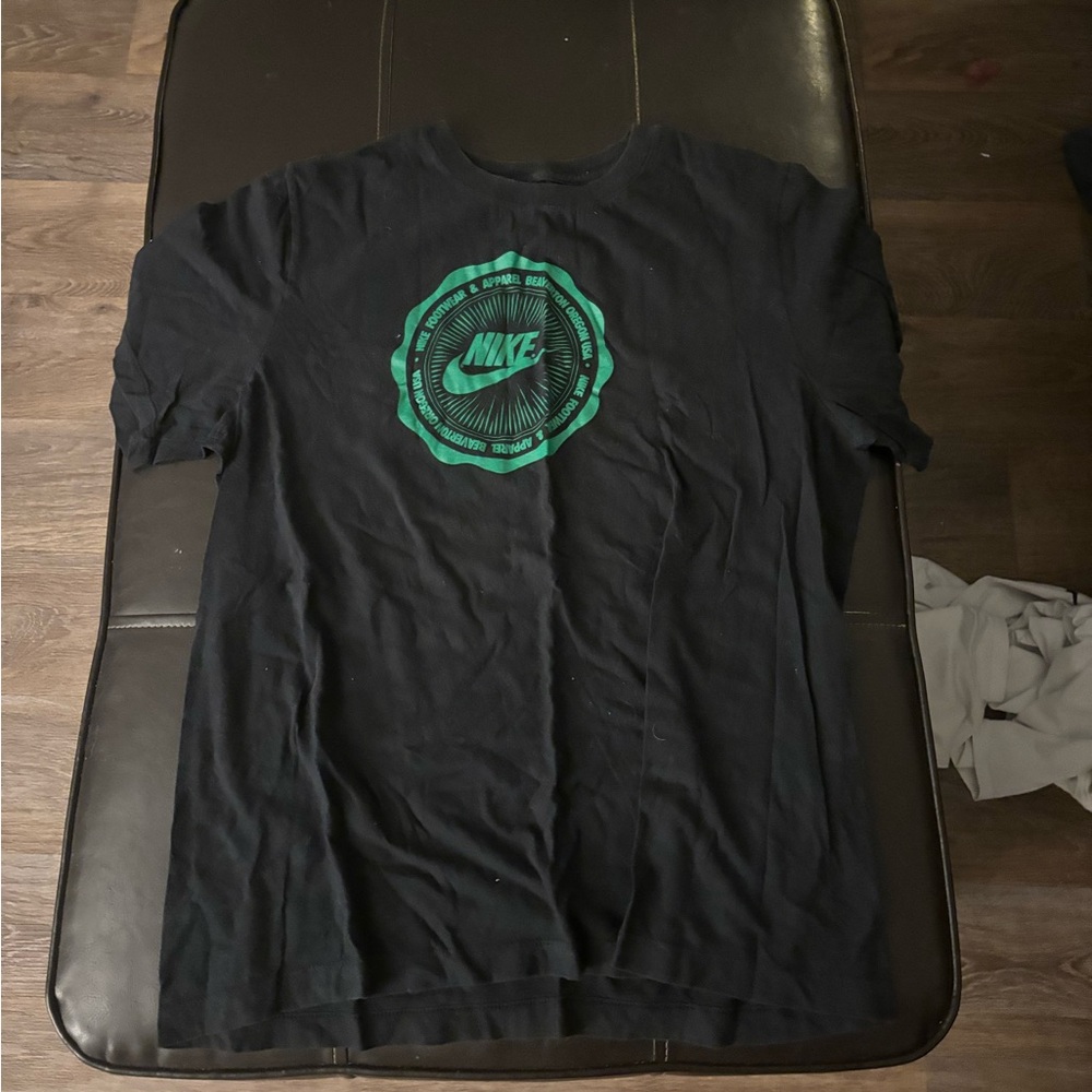 Black and green Nike shirt